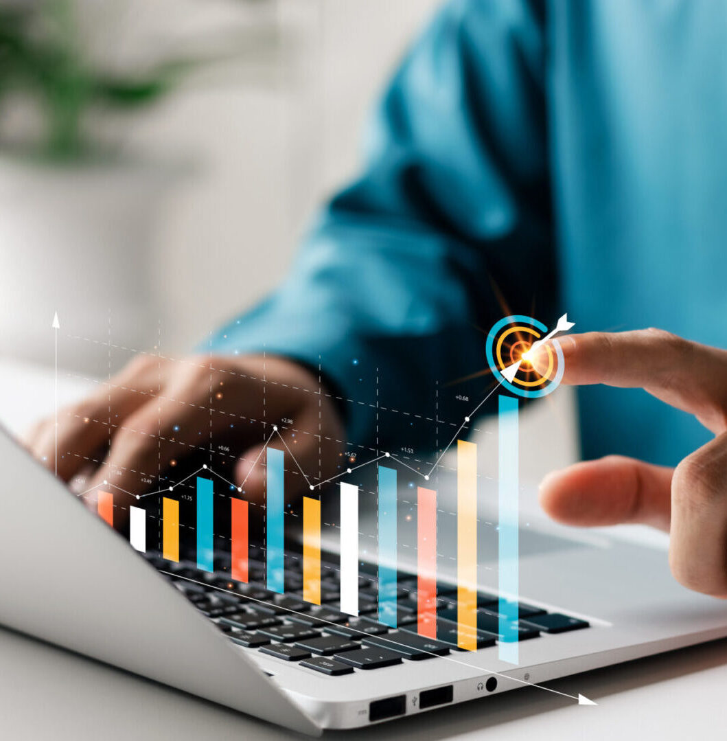 Businessman analyzing company's financial balance sheet working with digital augmented reality graphics. Businessman calculates financial data for long-term investment.